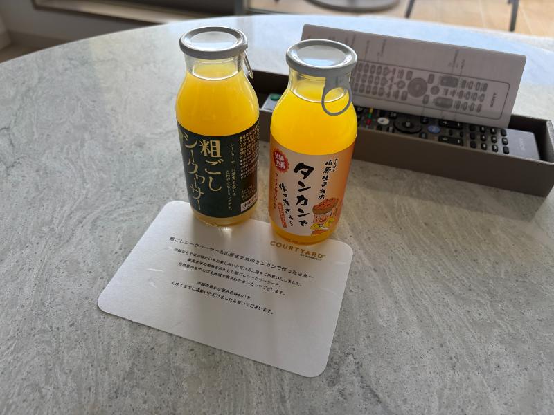 ウェルカムドリンクのシークヮーサーとタンカンジュース